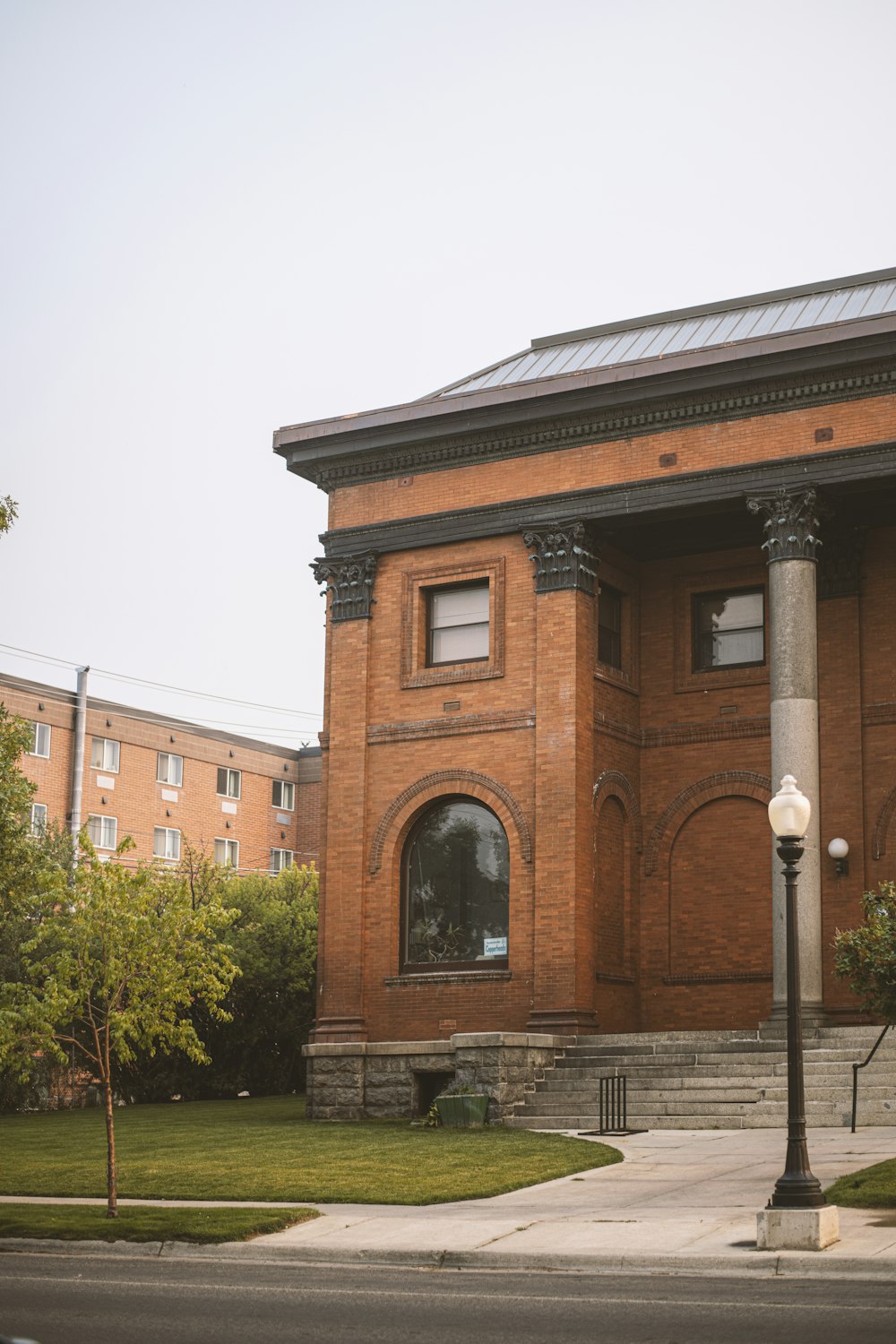 a red brick building with a clock on the front of it