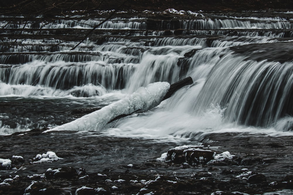 a large waterfall with water cascading over it