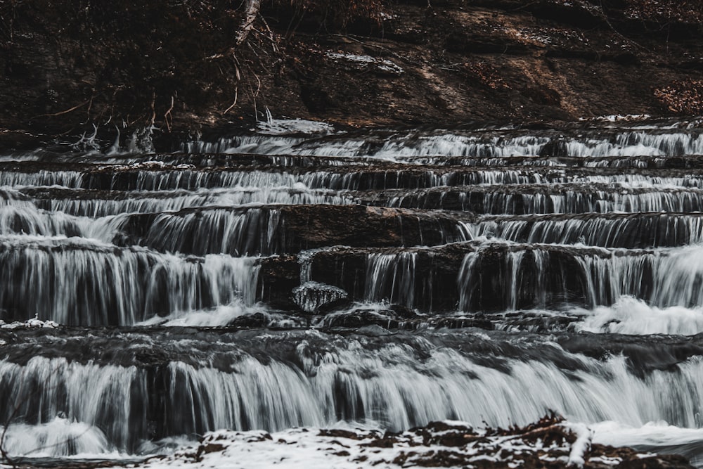 a large waterfall with lots of water running over it