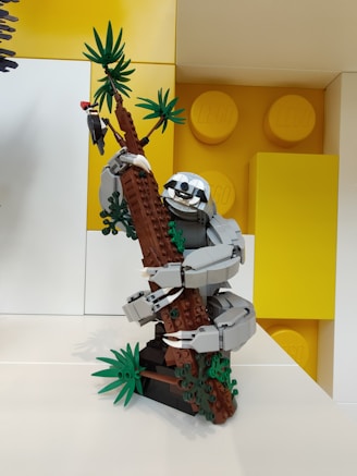 a lego model of a man climbing a tree