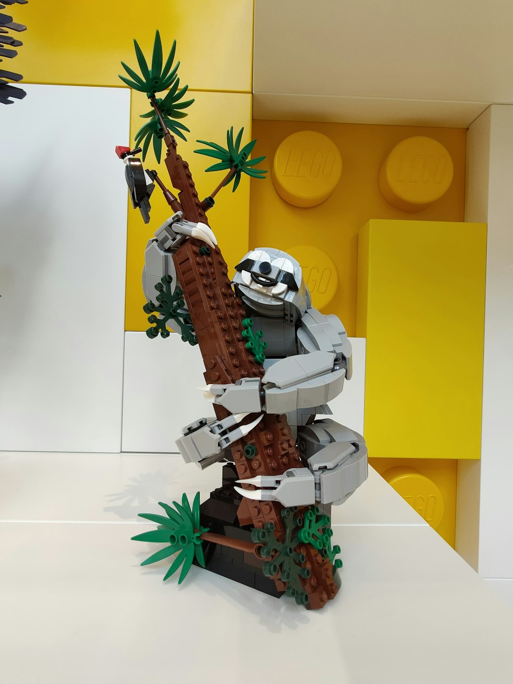 a lego model of a man climbing a tree