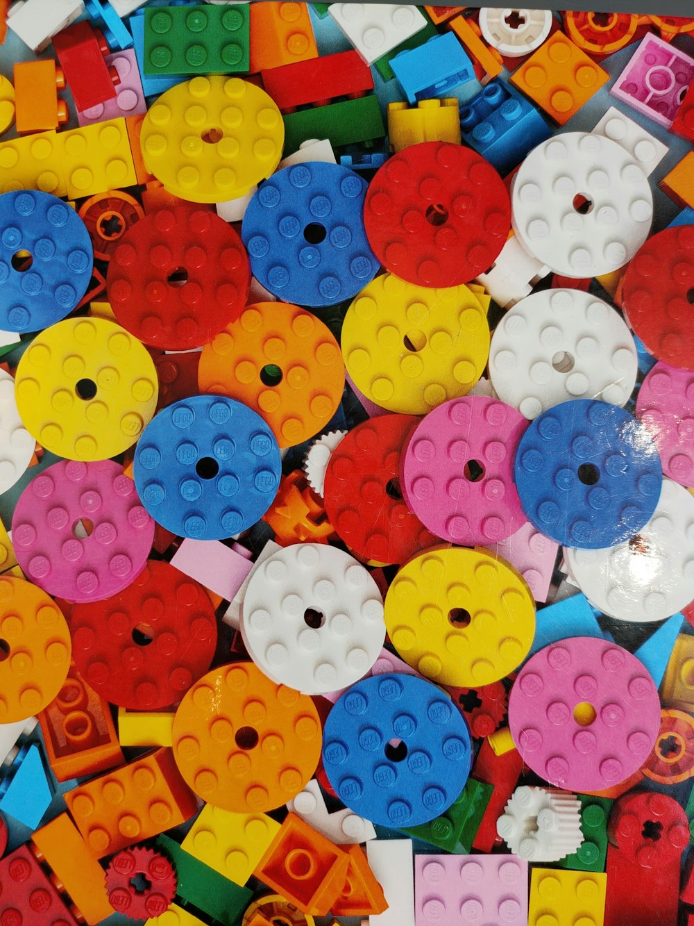 a pile of colorful legos sitting on top of a table