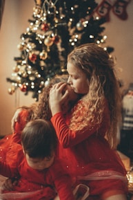 A festive scene with children opening gifts, showcasing happiness.