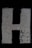 the letter h is made up of cracked concrete