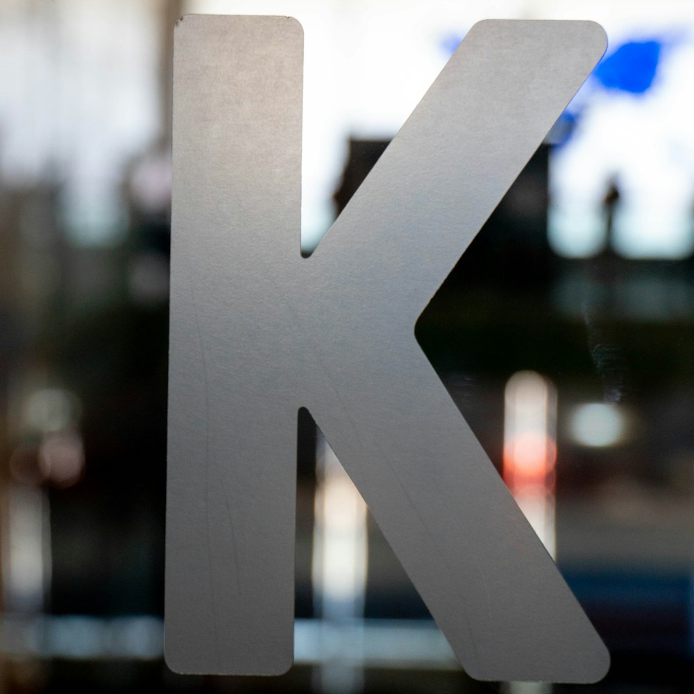 a close up of a metal letter k