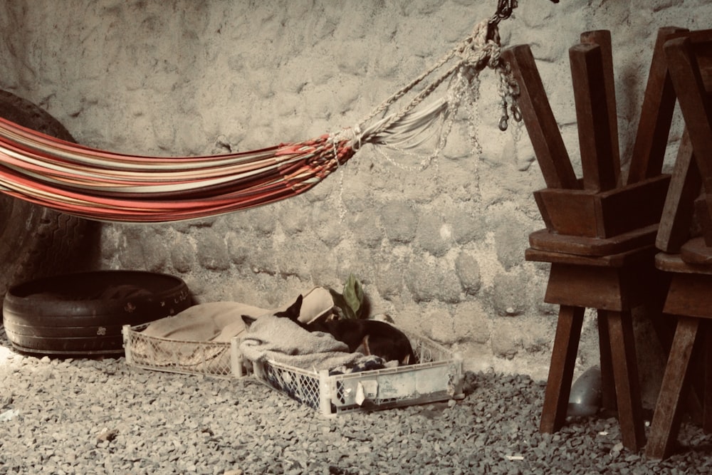 a hammock hanging from a stone wall