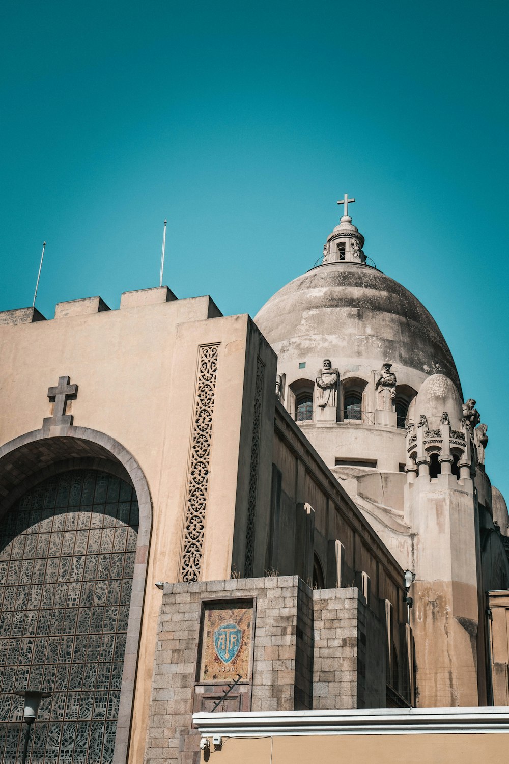 a large building with a cross on top of it