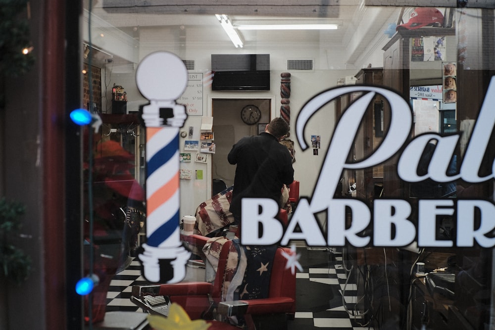 a barber shop with a barber chair in the window