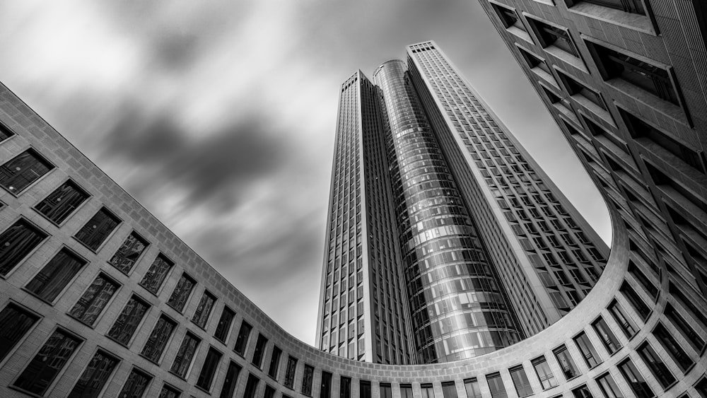 a black and white photo of two tall buildings