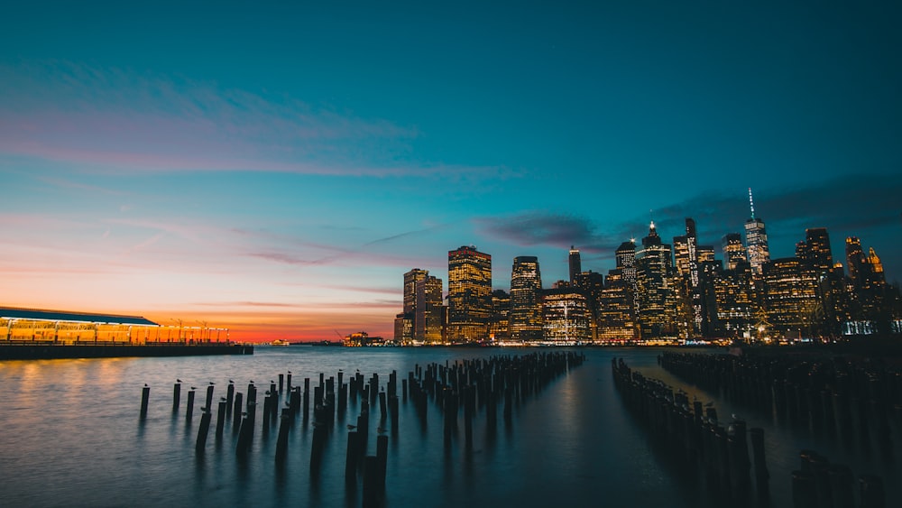 a large body of water with a city in the background