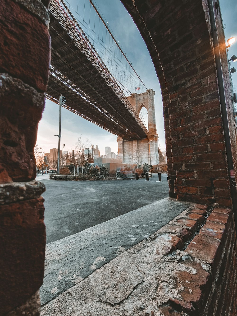 a view of the brooklyn bridge from under a bridge