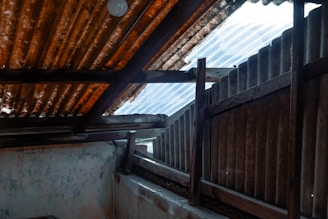 A cozy common area under a metal roof with natural light filtering through