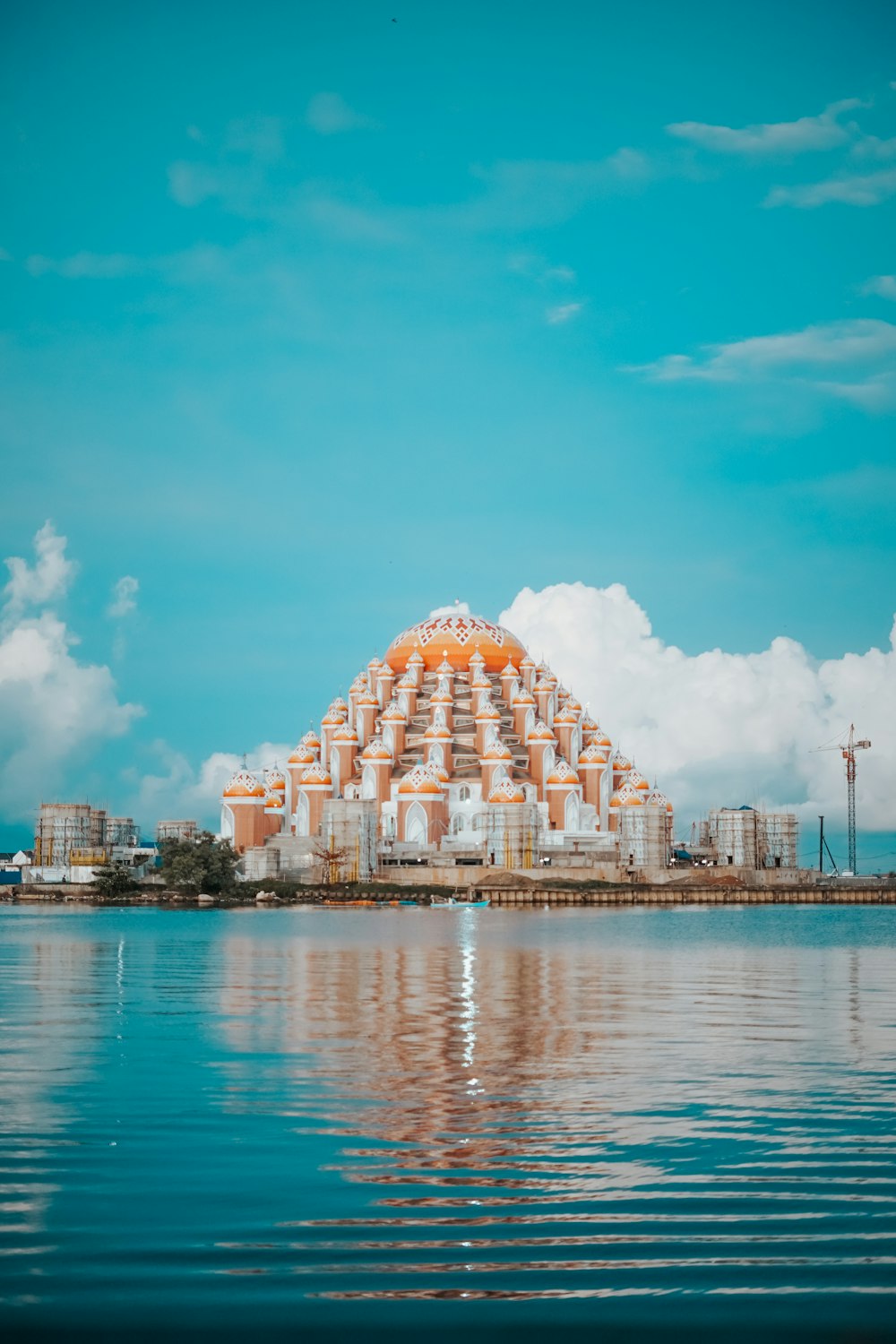 a large building sitting on top of a body of water