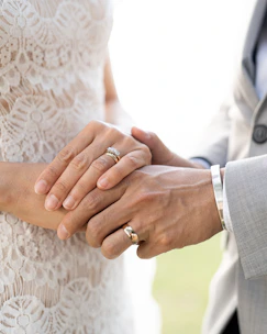 a close up of a person holding a person's hand