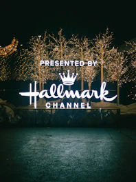 a lighted sign that reads, presented by halemark channel