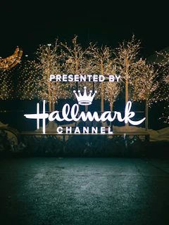 a lighted sign that reads, presented by halemark channel