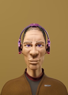 A digitally rendered character with exaggerated facial features, large eyes, and purple headphones. The character wears a brown textured jacket with a logo and has a calm expression. The background is a solid mustard color.