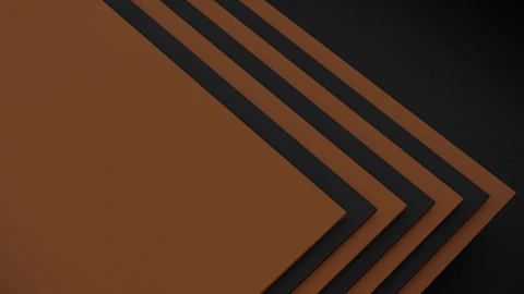 a stack of brown papers sitting on top of each other