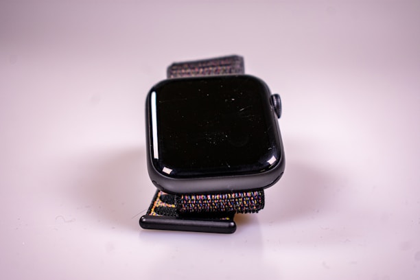 Close-up of a stylish smartwatch showcased on a minimalist black-and-white background.