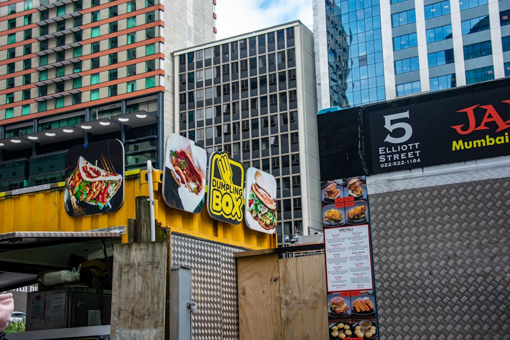 a man walking past a fast food restaurant in a city