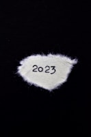 Blue scarves featuring the United States colors and World Cup 2026 branding displayed on a wooden table.