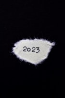 A stylish football scarf featuring bold 2026 World Cup graphics draped over a chair.