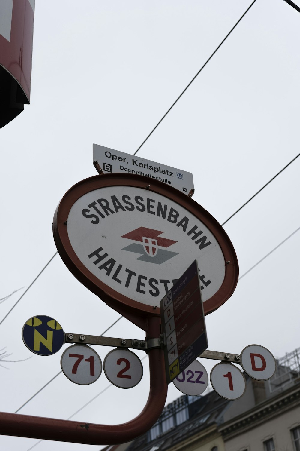 a close up of a street sign with a building in the background