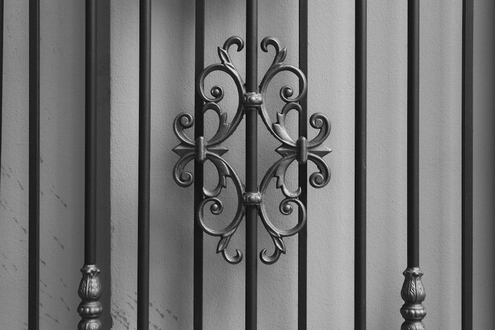 a black and white photo of a clock on a wall