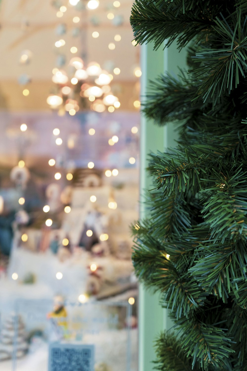 a christmas tree in front of a store window