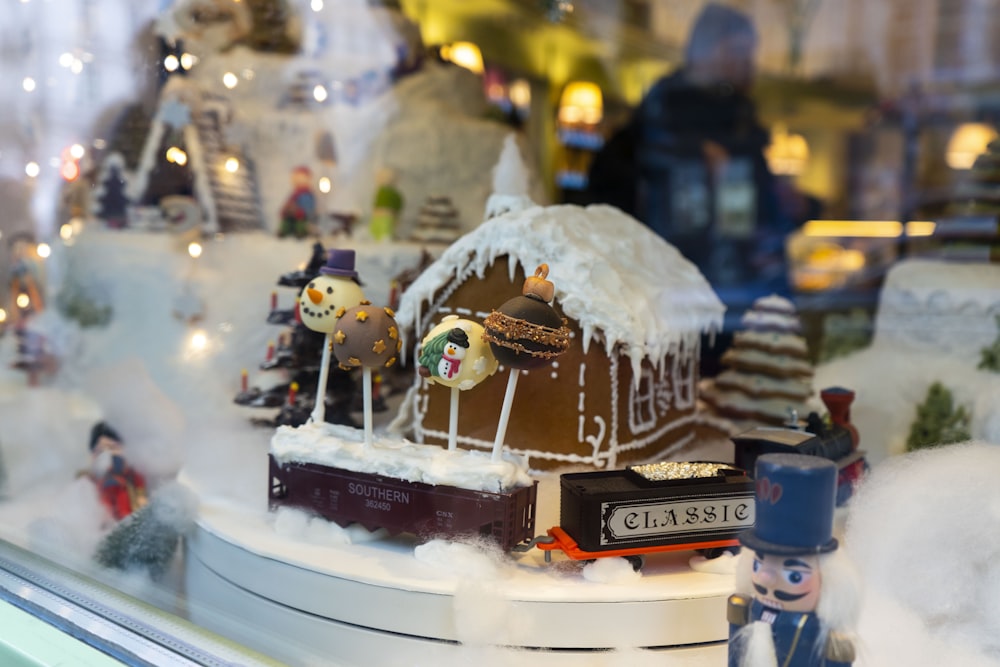 a window display of a gingerbread house