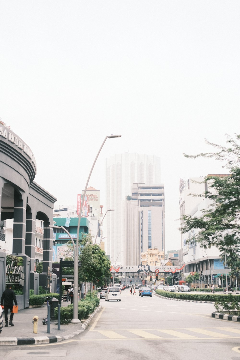 a city street filled with lots of tall buildings