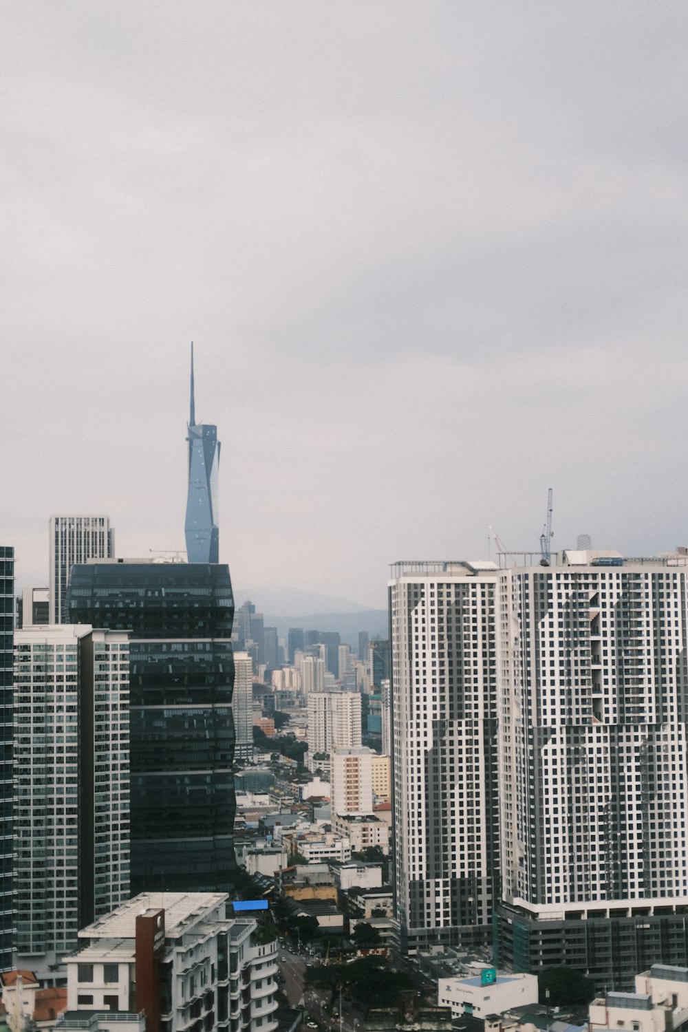 a view of a city with tall buildings