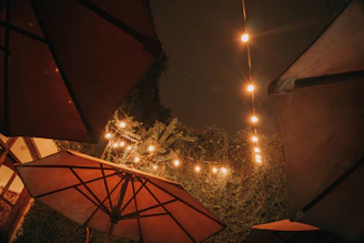 A cozy outdoor patio with terravela's waterproof curtains gently swaying in the breeze.