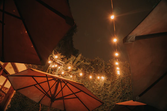 A cozy outdoor patio with terravela's waterproof curtains gently swaying in the breeze.
