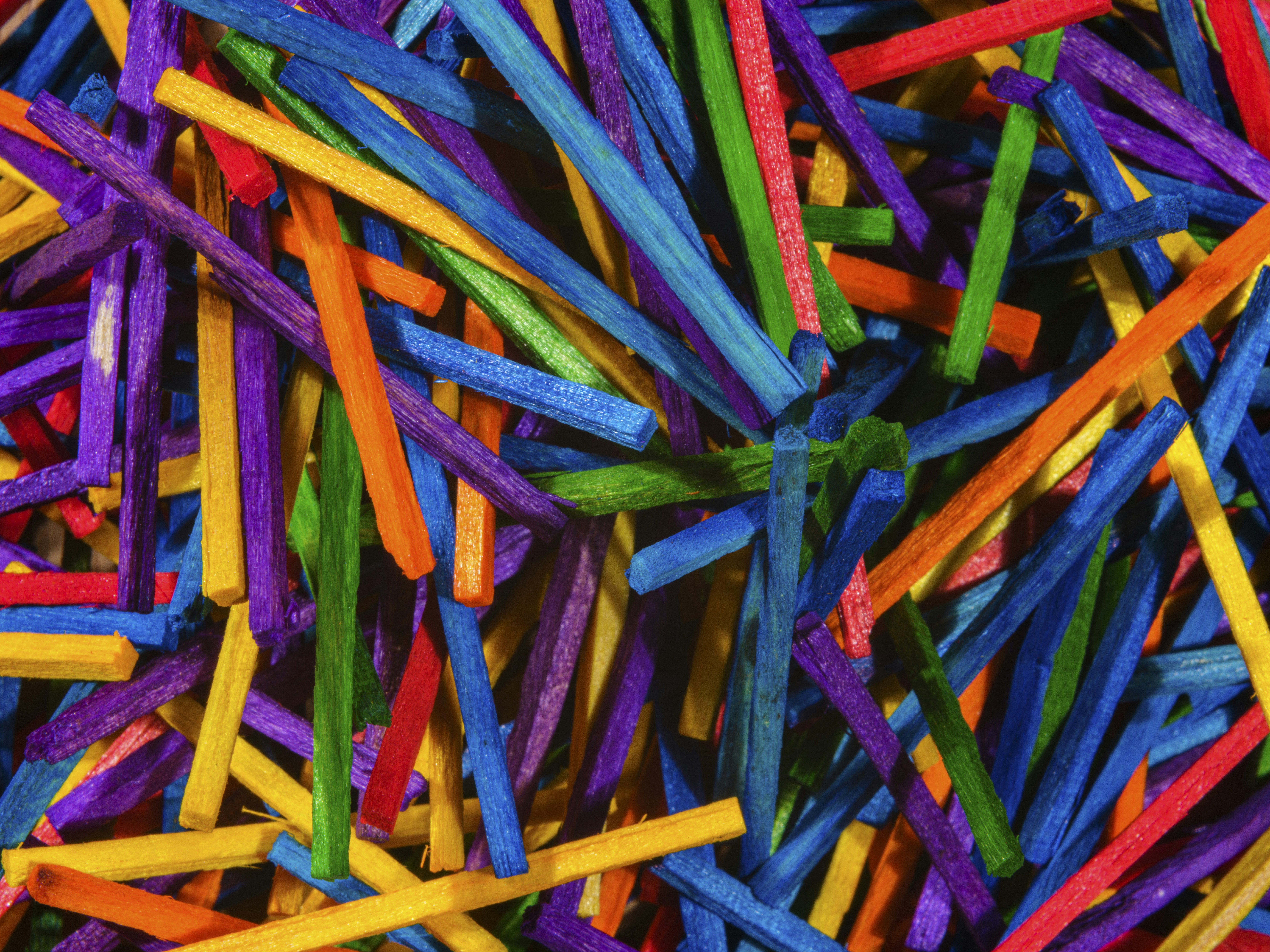 a pile of colorful sticks of different colors