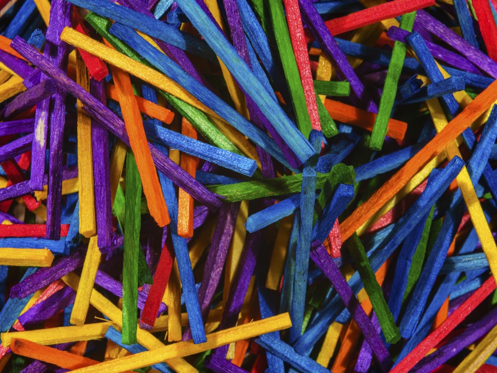 a pile of colorful sticks of different colors