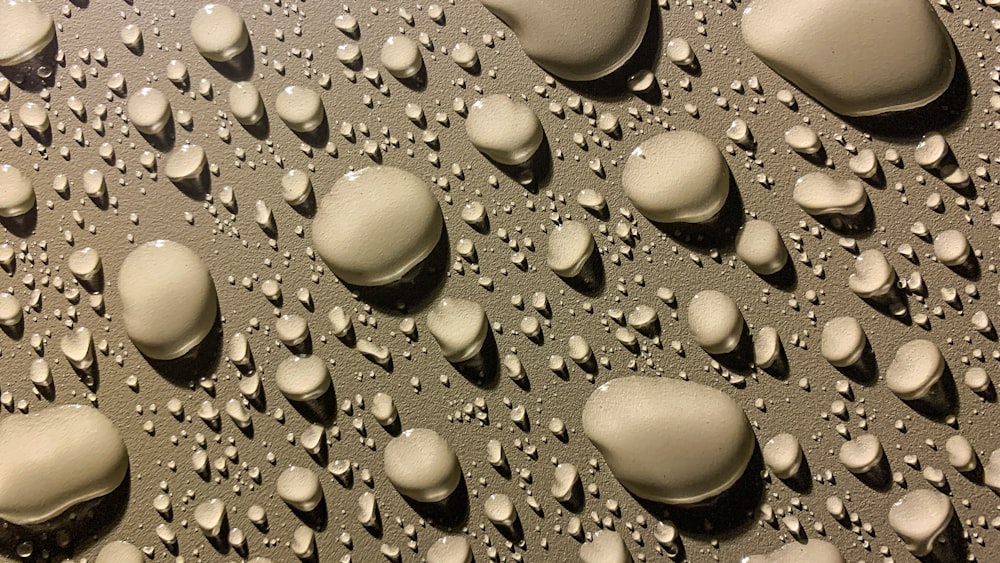 a close up of a bunch of water droplets on a surface