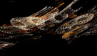 A dynamic frame from a video vignette showing swirling light patterns.