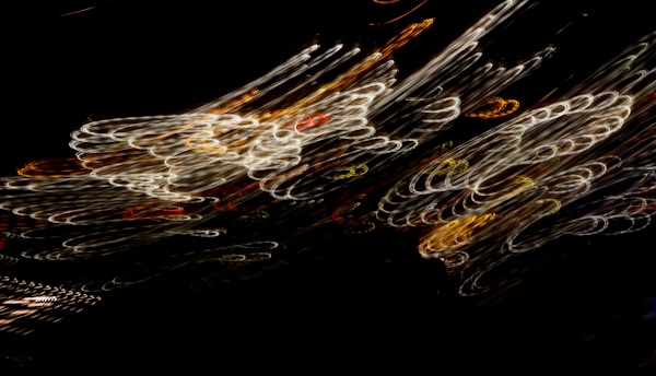 A dynamic frame from a video vignette showing swirling light patterns.
