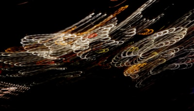 A still frame from a sound-driven experimental video, showing swirling patterns of light.