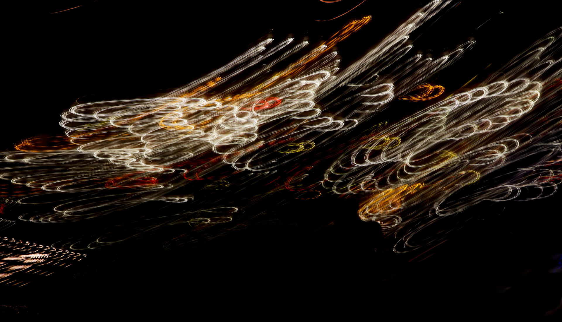 Soft pulses of dim light moving through a black space, giving the impression of a living, breathing dark animation.