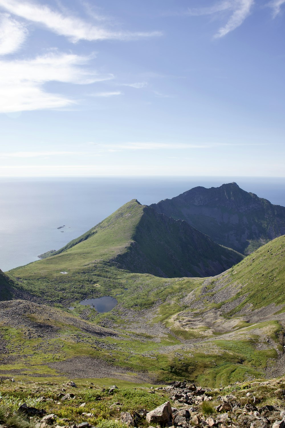 a view of a mountain range with a body of water in the distance