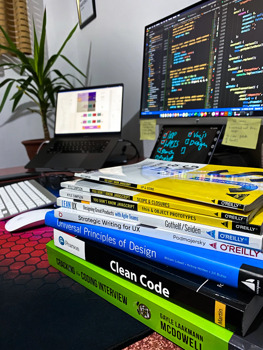 Analyst reviewing charts and a data dashboard on a wide monitor