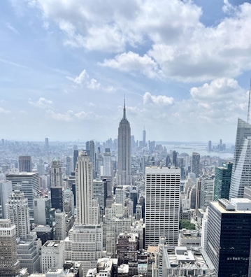 A panoramic view of multiple towers in a cityscape.