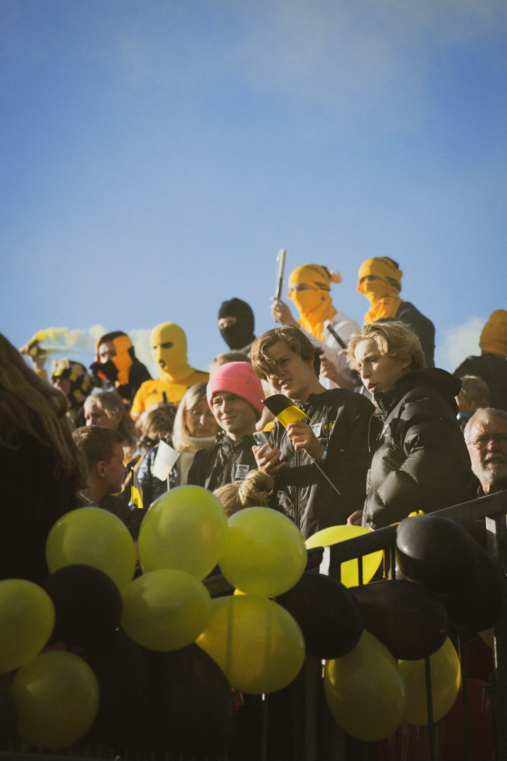 a crowd of people standing next to each other