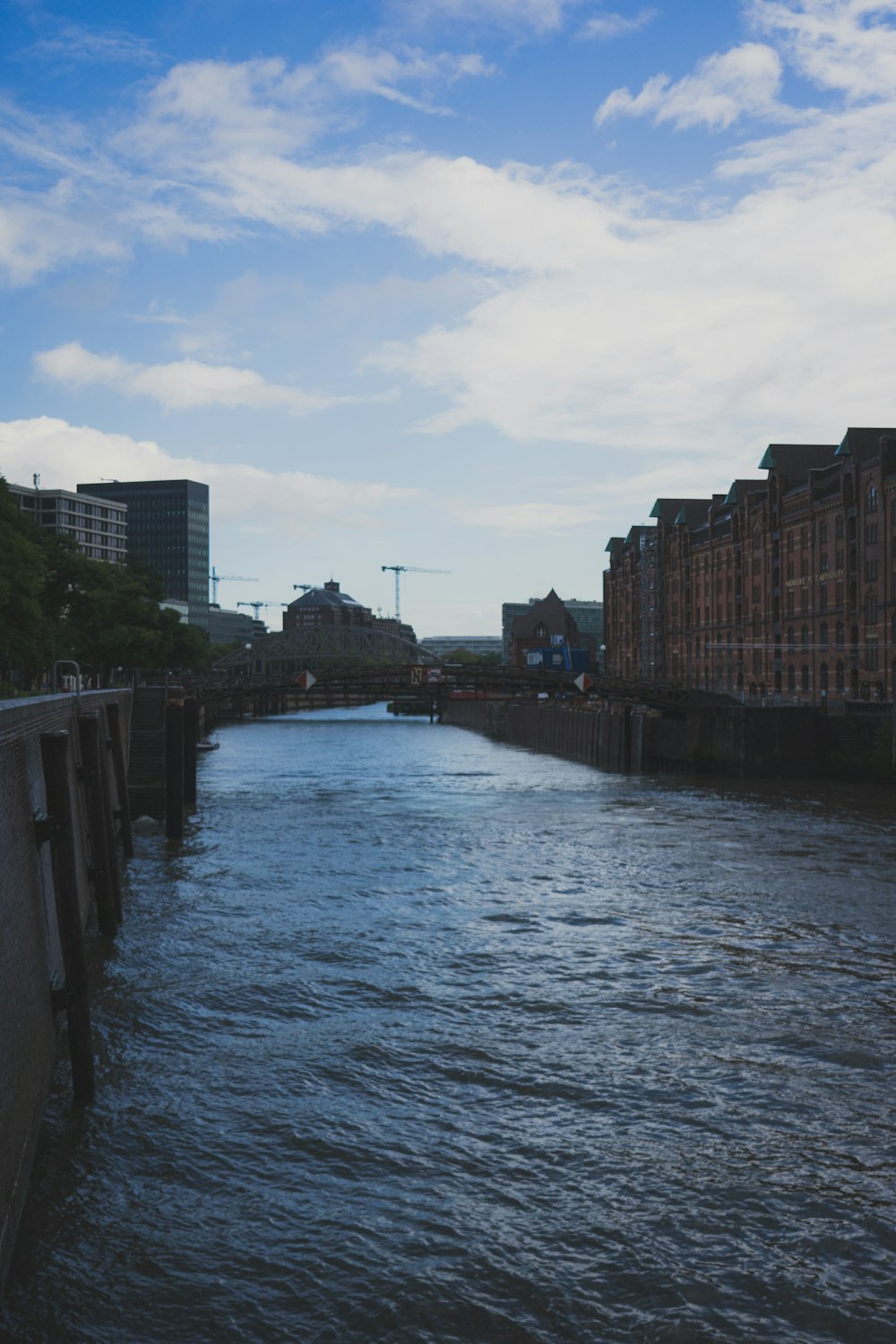 a river running through a city next to tall buildings