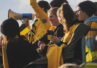 a group of people sitting next to each other