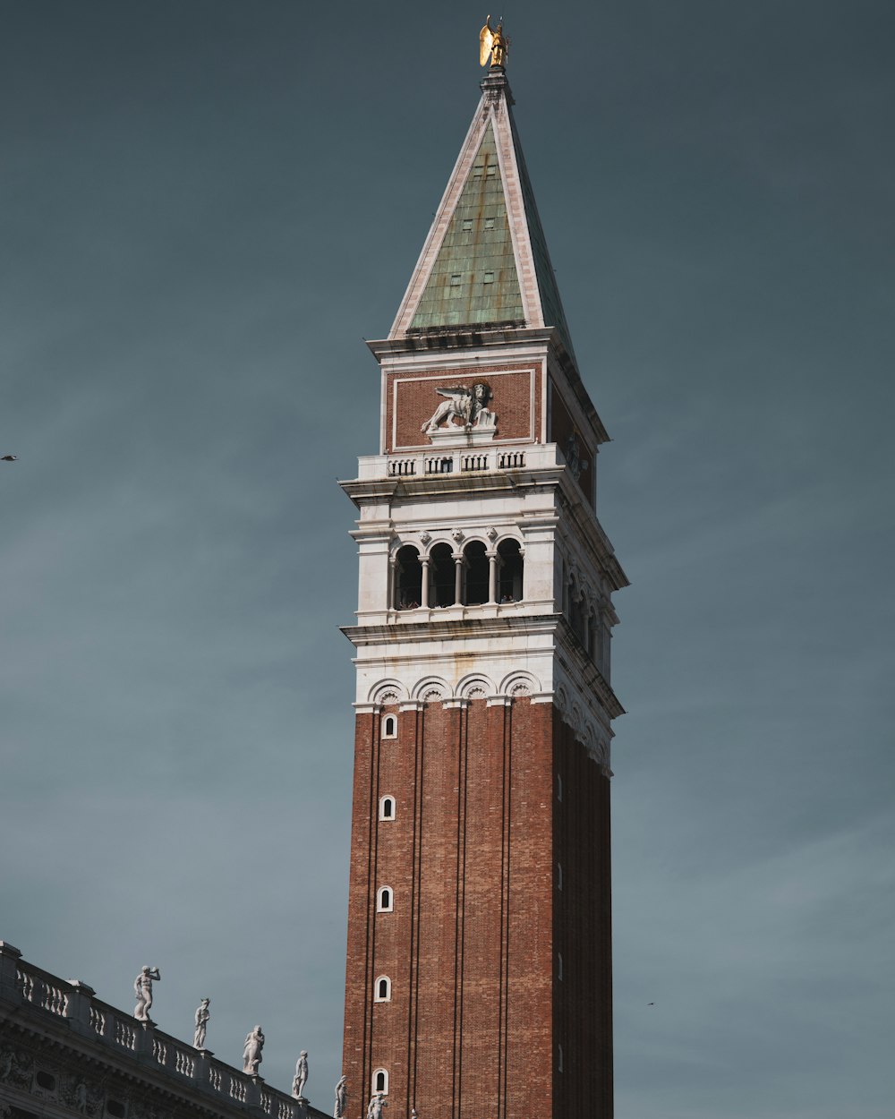 a tall tower with a clock on the top of it