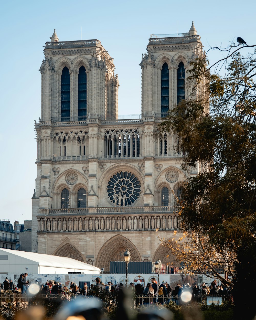 a group of people standing in front of a large cathedral