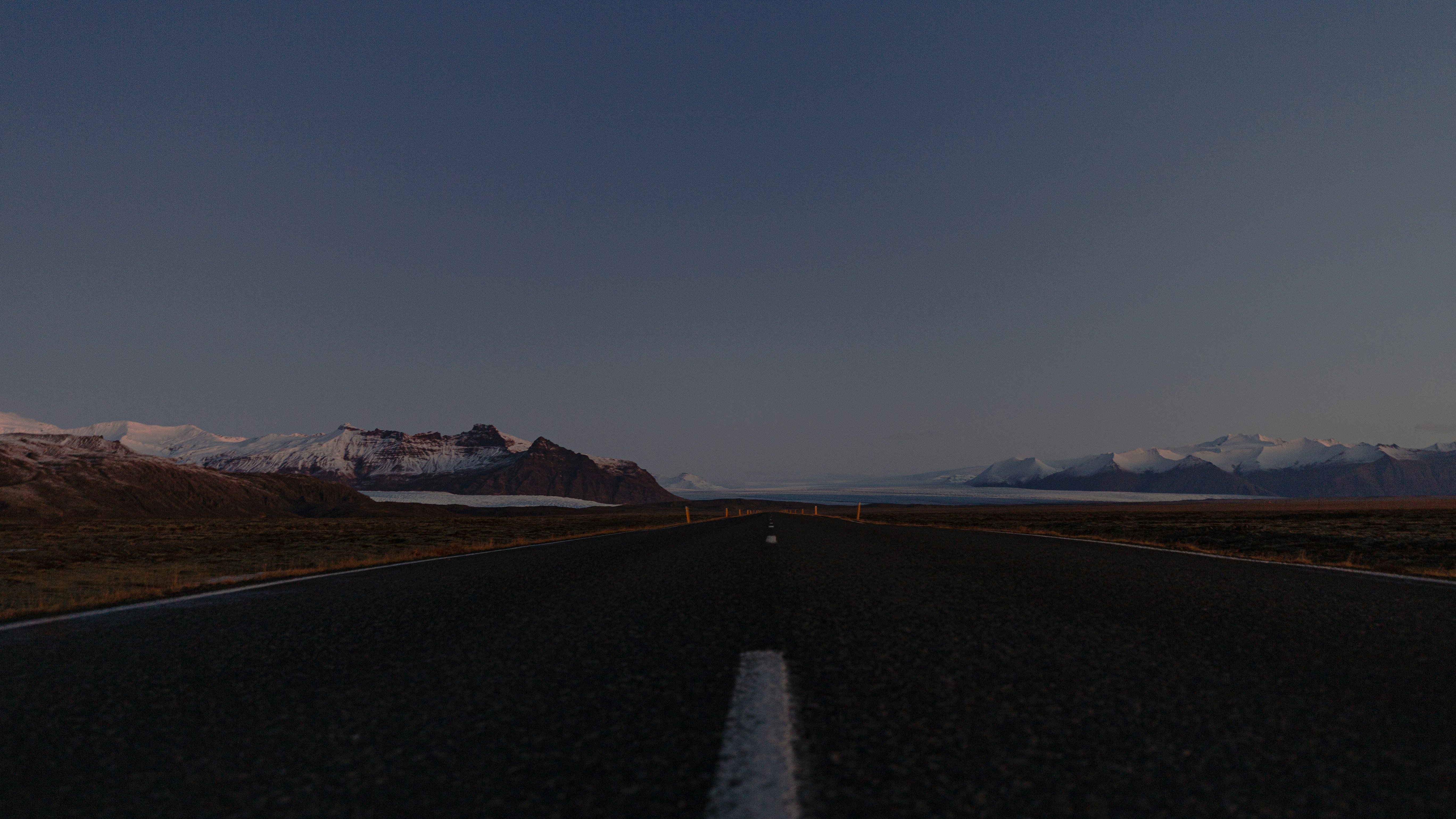 Empty road with mountains
